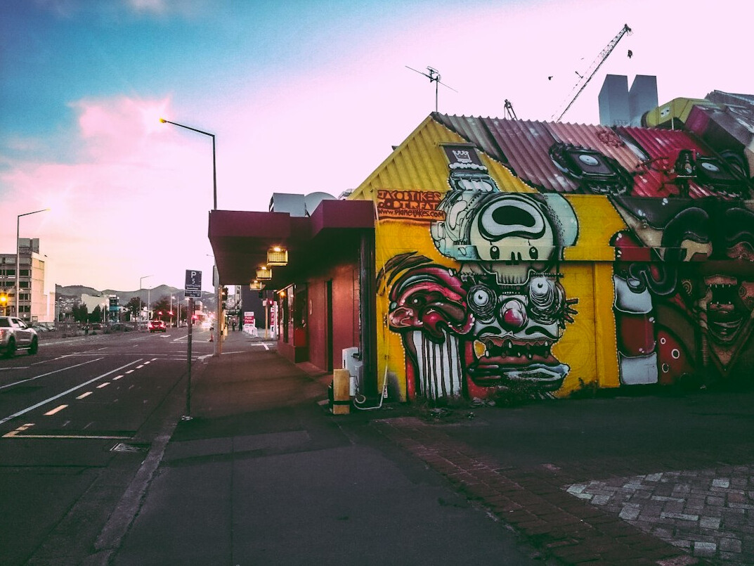 Street with murals and small bars in Bellavista neighborhood, Santiago